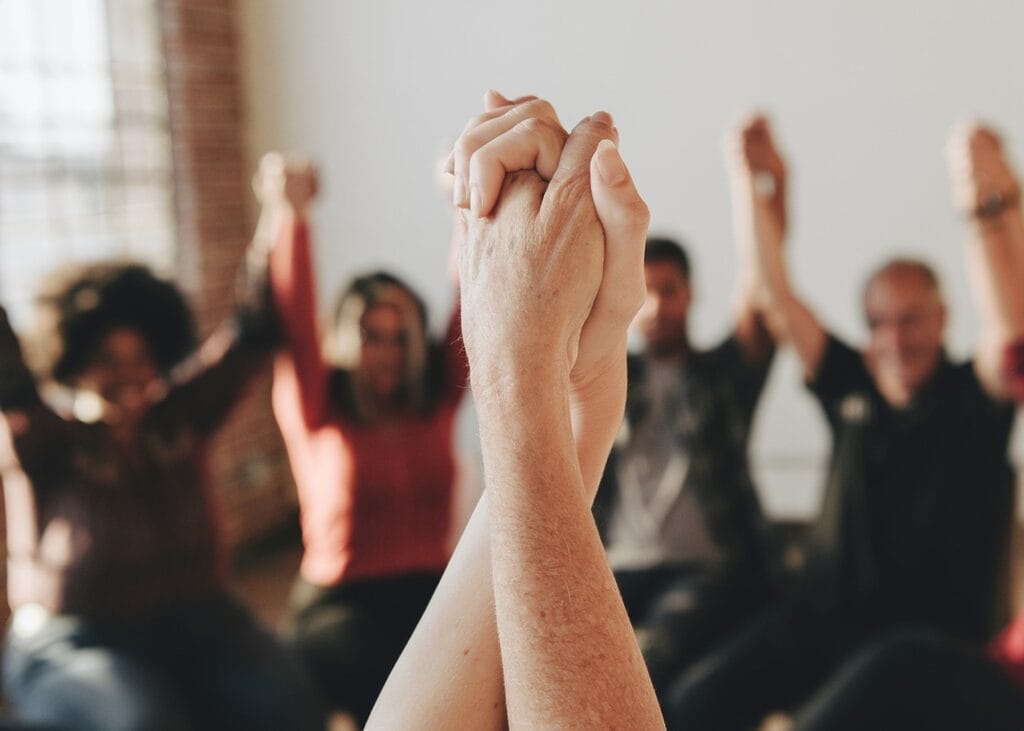 Christian rehab program group prayer session