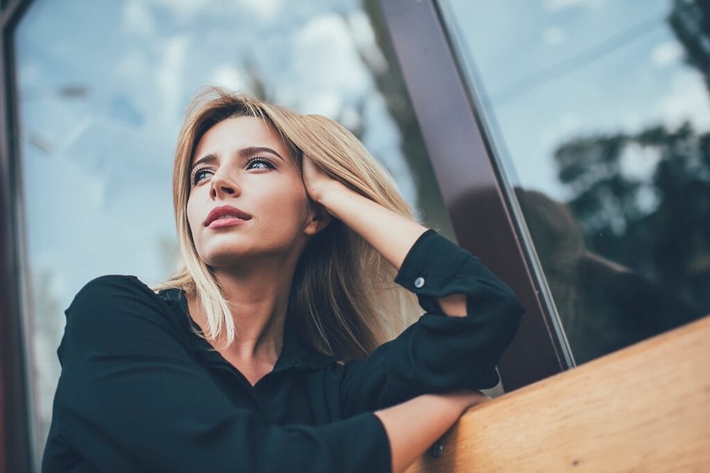 Woman contemplating spiritual recovery journey